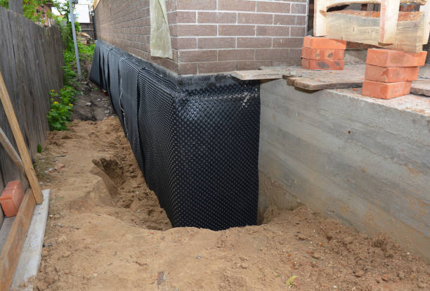 SJ Waterproofing Pros technician performing targeted Interior Drainage System assessment in Cambridge, IL